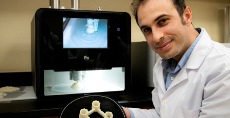 researcher displaying a 3D printed product