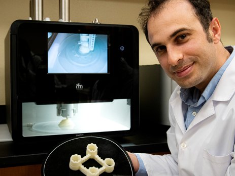 researcher displaying a 3D printed product