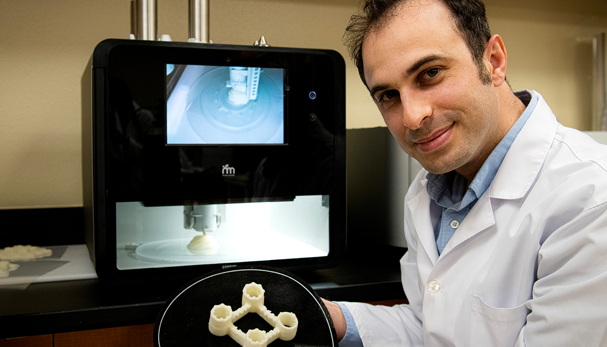 researcher displaying a 3D printed product