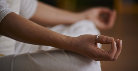 closeup photo of hands in a meditative pose