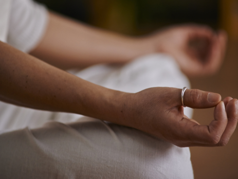 closeup photo of hands in a meditative pose