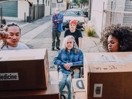 volunteers give donated goods to citizens