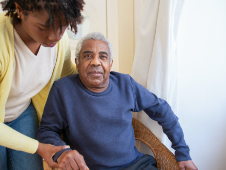 a woman cares for her elderly father