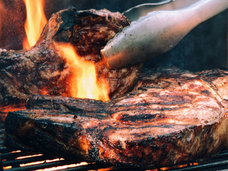 grilling steaks on the grill