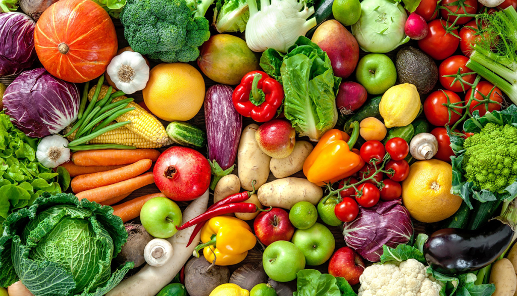 an overhead view of a variety of colorful fruits and vegetables