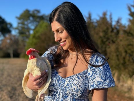 women holding a hen