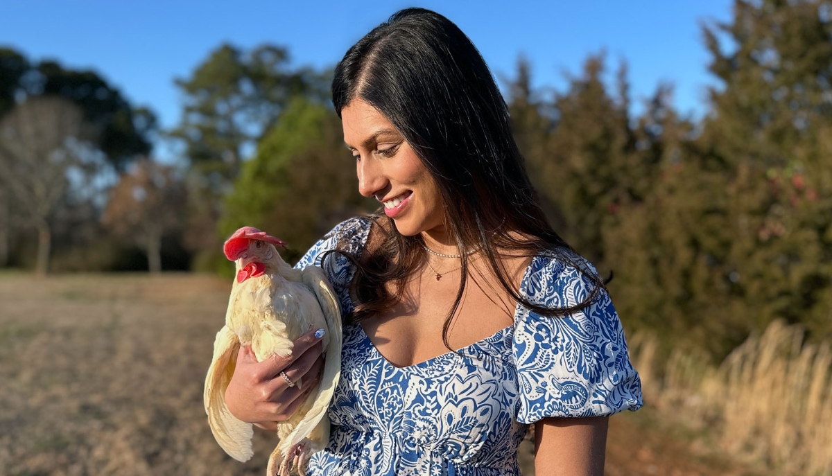 women holding a hen