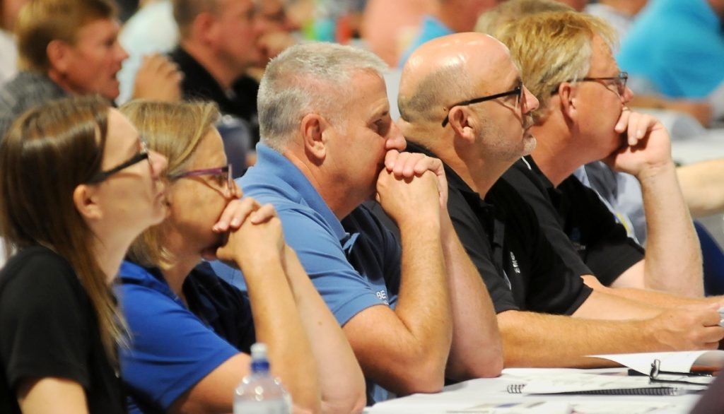 attendees listening at a workshop