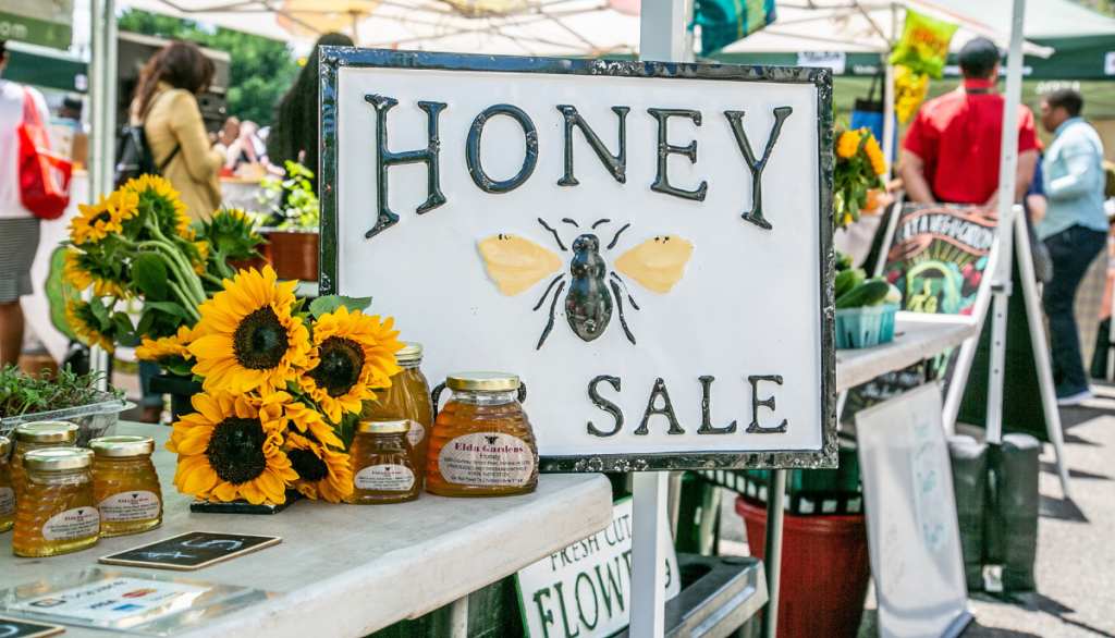 honey sale sign at a farmers market
