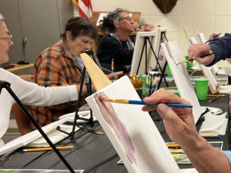 a group of seniors painting