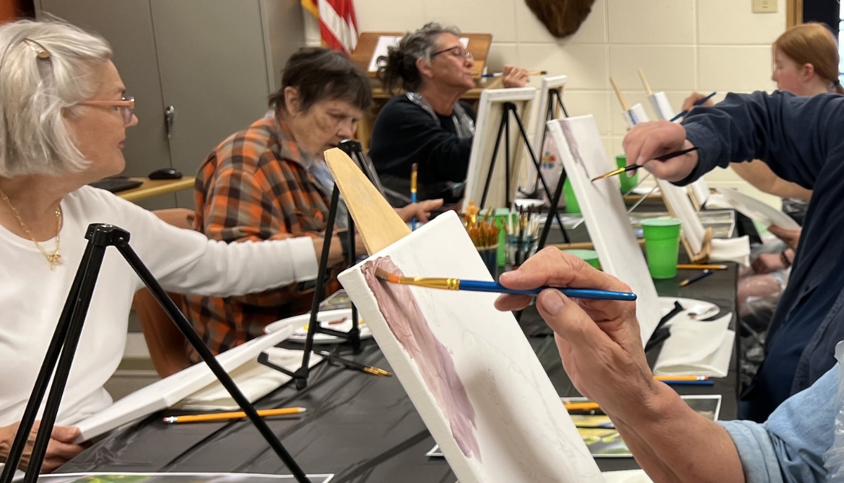 a group of seniors painting