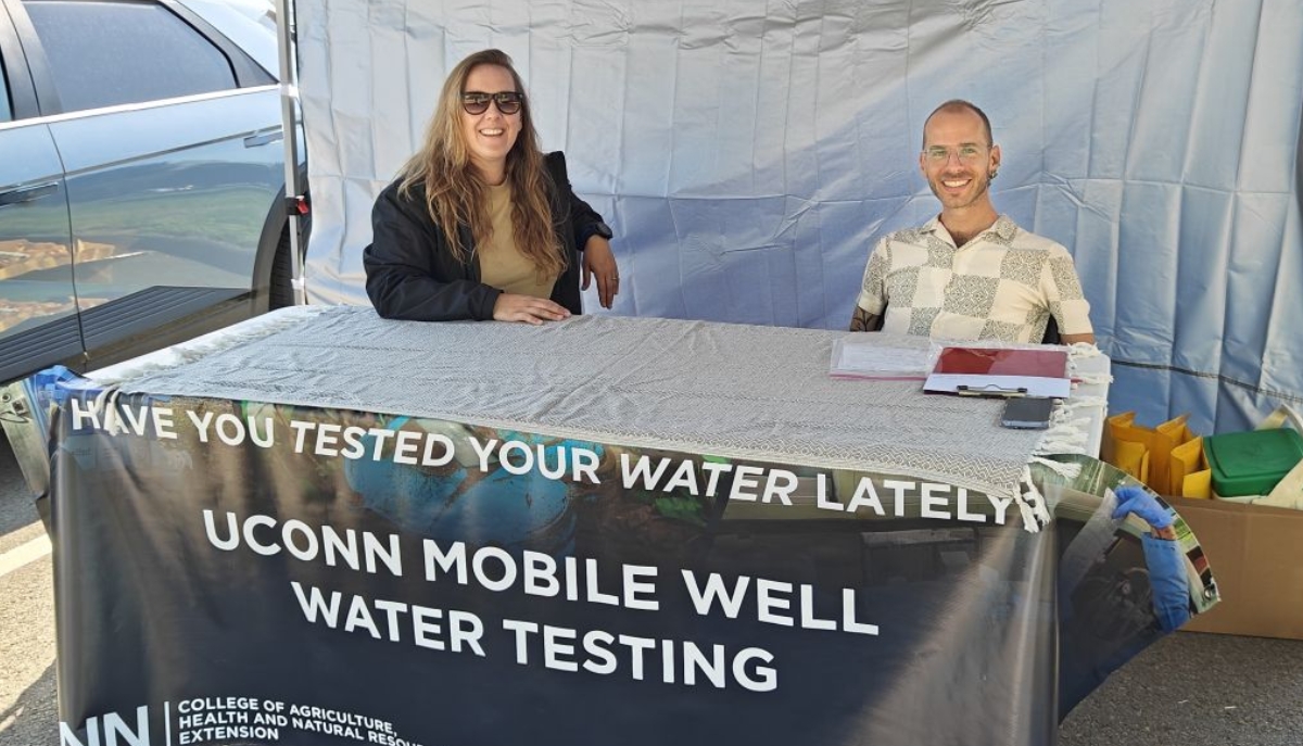 UConn Extension experts at a well water testing booth
