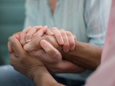 holding hands for support