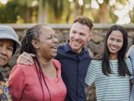 a group of people outdoors, smiling
