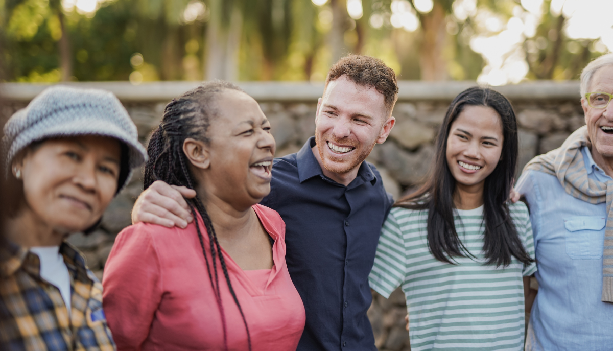 a group of people outdoors, smiling
