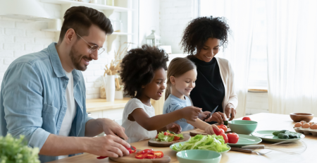 a family preparing a salad