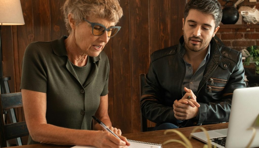 an instructor tutors an adult student