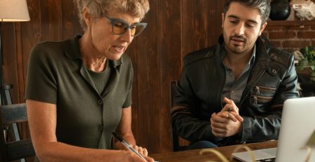 an instructor tutors an adult student