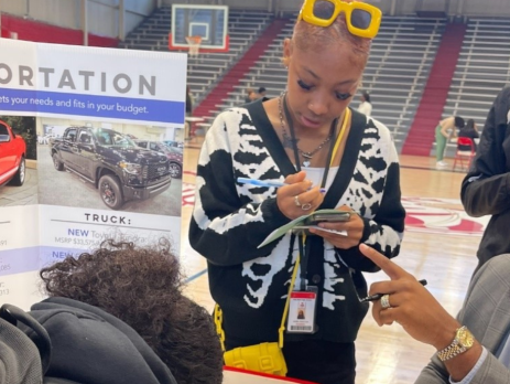 youth learn about financial education in a fair setting