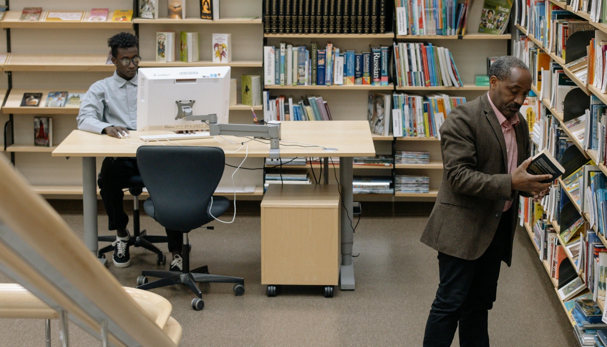 a person uses a desktop computer at a library