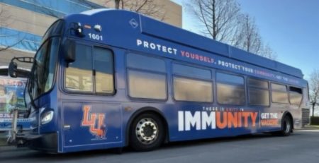 Unity in Immunity Awareness OKC Bus Wrap Campaign sponsored by Langston University Extension