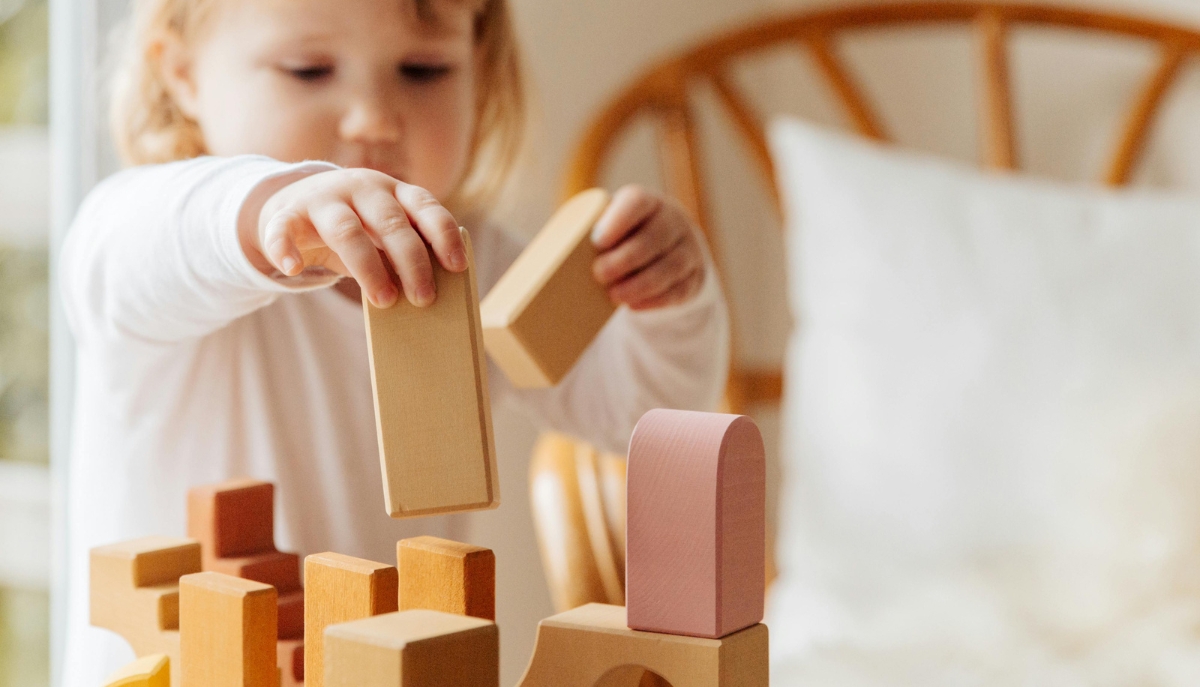 child playing with building blocks